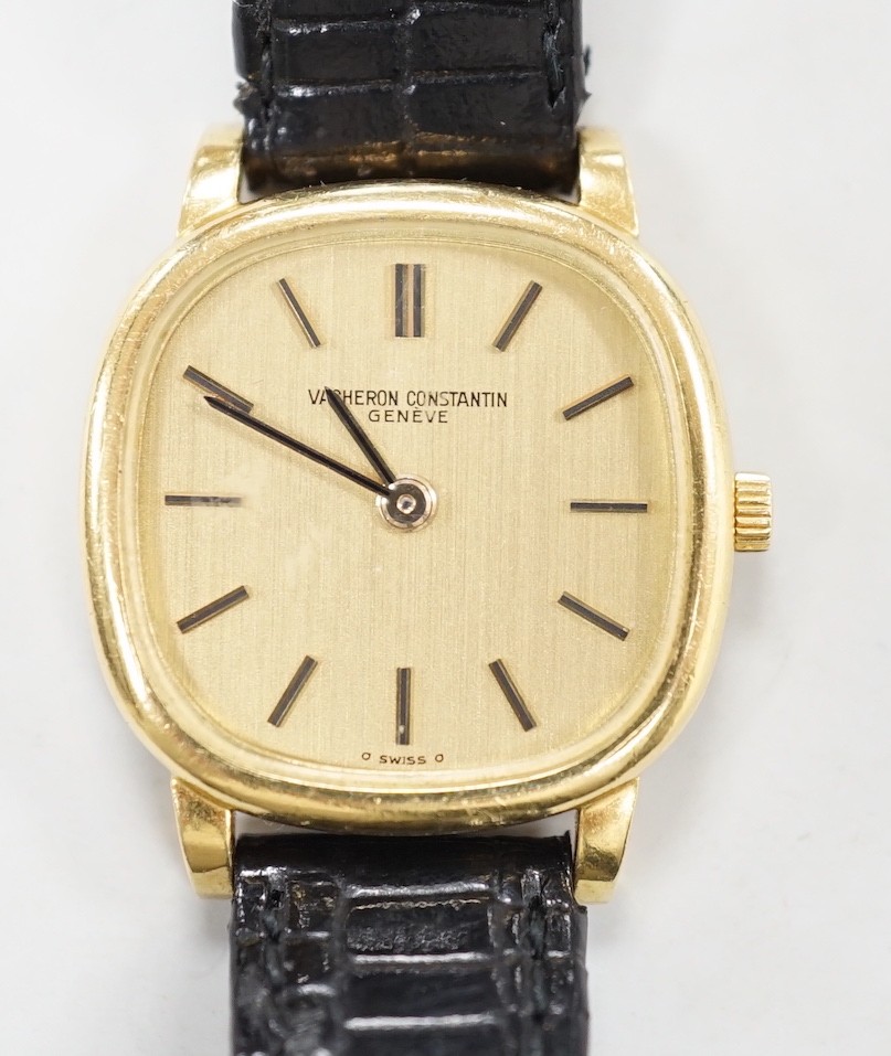 A lady's 18ct gold Vacheron & Constantin, manual wind wrist watch, on associated leather strap with 750 buckle, case diameter 23mm.